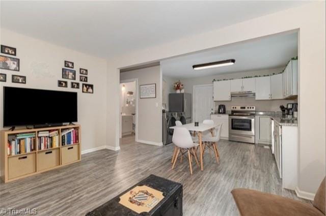 living room with light hardwood / wood-style floors