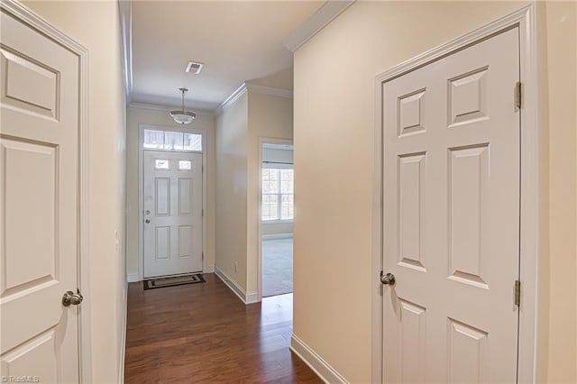 foyer featuring dark hardwood / wood-style floors and ornamental molding