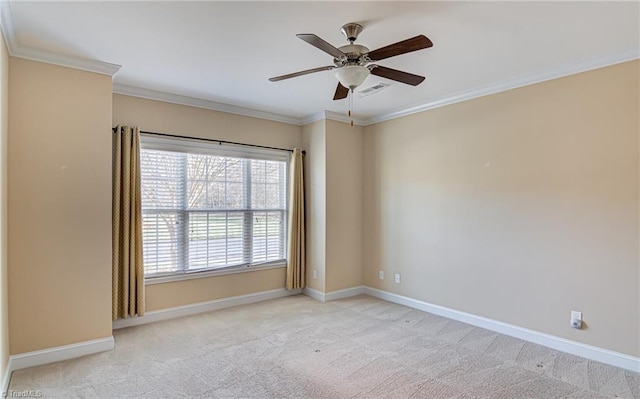 empty room with ceiling fan, light colored carpet, and ornamental molding