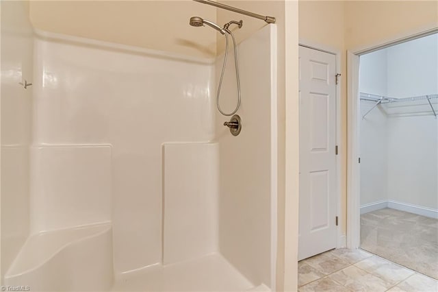 bathroom featuring tile patterned floors and walk in shower