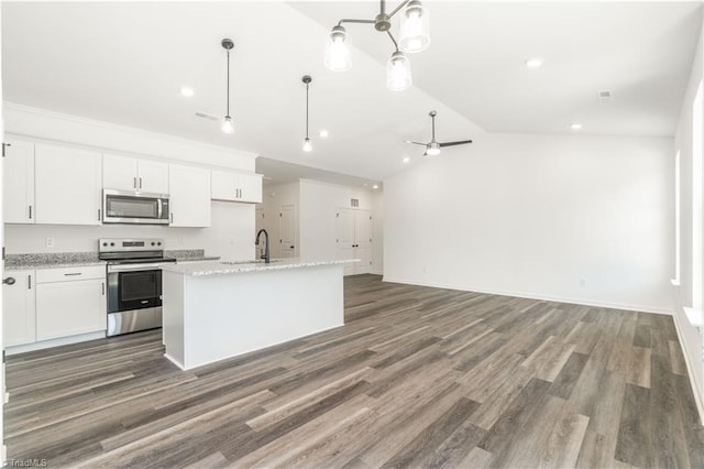 kitchen with white cabinets, ceiling fan, and stainless steel appliances