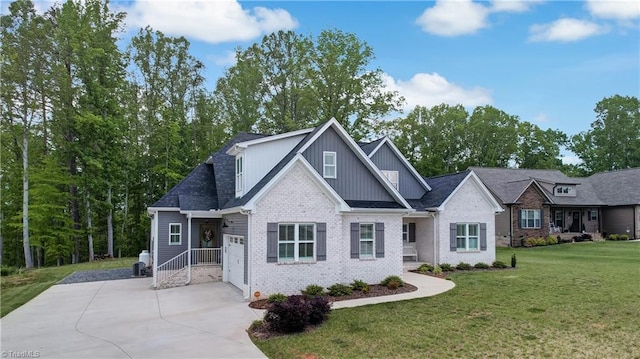 view of front of house featuring concrete driveway, a garage, a front yard, board and batten siding, and brick siding