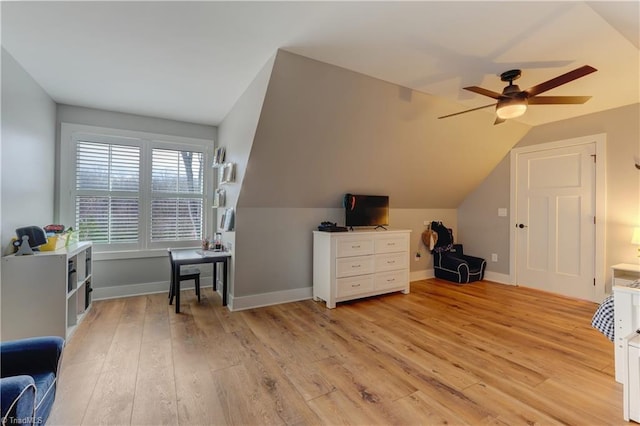 additional living space featuring ceiling fan, vaulted ceiling, light wood finished floors, and baseboards