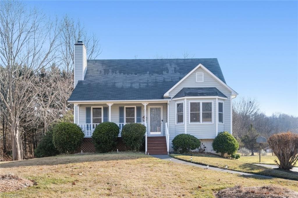 view of front of home featuring a front lawn and a porch