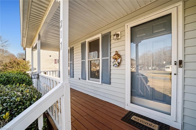 wooden terrace featuring a porch