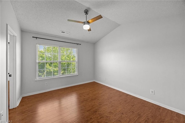 1948 Ray Alexander Dr, Greensboro, NC 27410 - spare room featuring ceiling fan, wood finished floors, a textured ceiling, vaulted ceiling, and baseboards