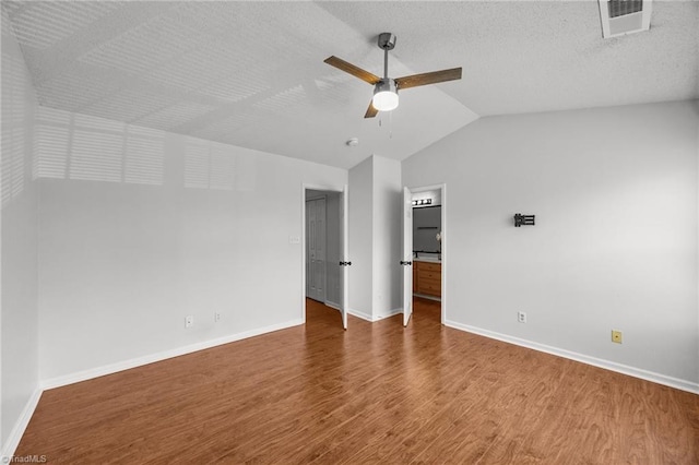 1948 Ray Alexander Dr, Greensboro, NC 27410 - unfurnished room with wood finished floors, a ceiling fan, lofted ceiling, and baseboards