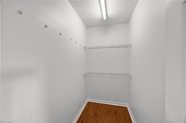 1948 Ray Alexander Dr, Greensboro, NC 27410 - walk in closet with wood finished floors