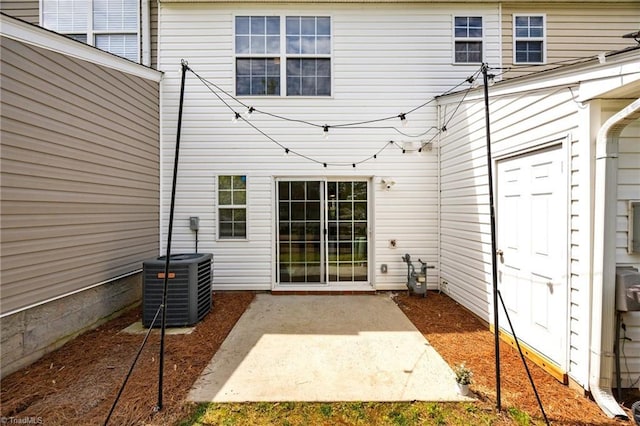 1948 Ray Alexander Dr, Greensboro, NC 27410 - doorway to property with cooling unit and a patio area