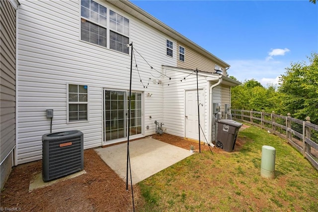 1948 Ray Alexander Dr, Greensboro, NC 27410 - rear view of property with central air condition unit and a patio area