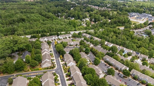 1948 Ray Alexander Dr, Greensboro, NC 27410 - aerial perspective of suburban area with a forest