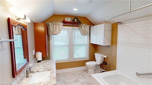 bathroom with baseboards, toilet, vaulted ceiling, and vanity
