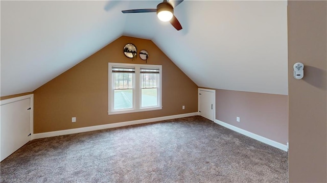 bonus room with baseboards, carpet flooring, vaulted ceiling, and a ceiling fan