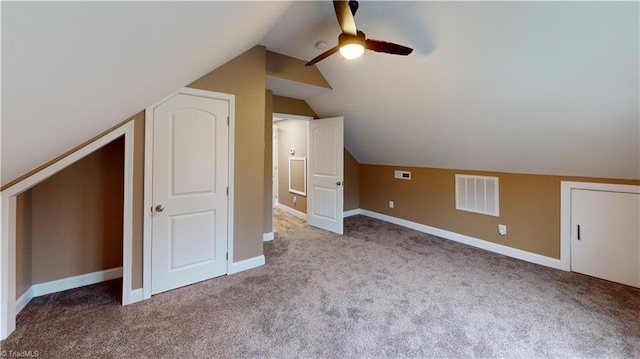 additional living space featuring a ceiling fan, carpet floors, baseboards, and visible vents
