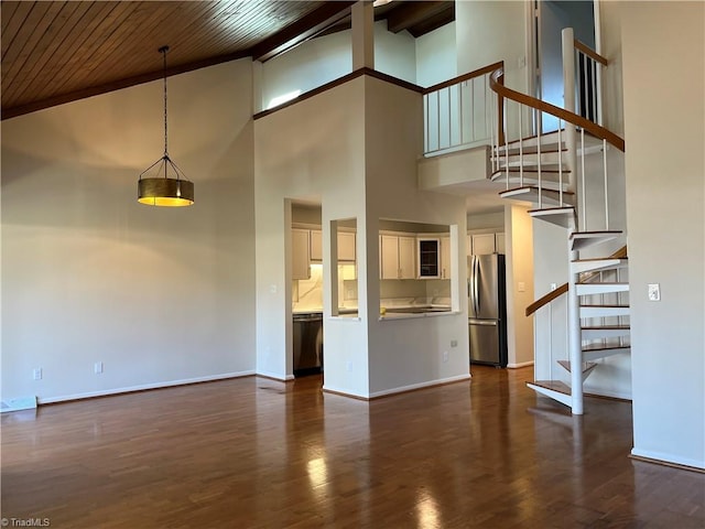 unfurnished living room with wooden ceiling, dark wood finished floors, baseboards, and stairs