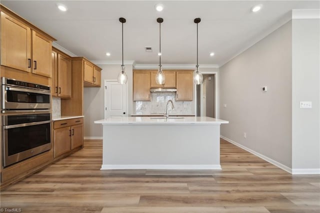 kitchen with light countertops, backsplash, stainless steel double oven, a sink, and light wood-type flooring