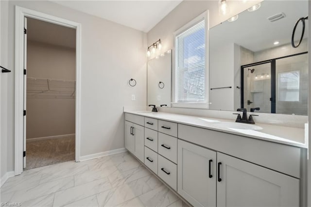 bathroom with visible vents, baseboards, marble finish floor, double vanity, and a stall shower