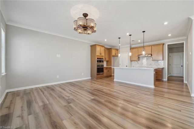 unfurnished living room with light wood-type flooring, baseboards, a chandelier, and ornamental molding