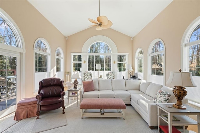 sunroom / solarium with vaulted ceiling and a ceiling fan