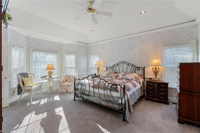 bedroom with ornamental molding, wallpapered walls, and carpet floors