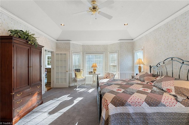 bedroom with wallpapered walls, crown molding, and carpet floors