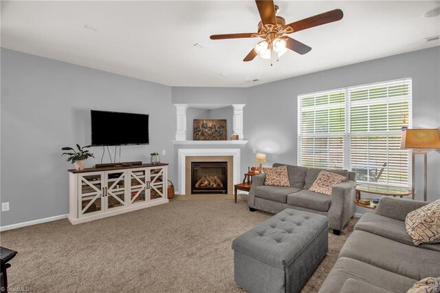 1420 Joyceland Rd, Kernersville, NC 27284 - carpeted living room with a glass covered fireplace, baseboards, and ceiling fan