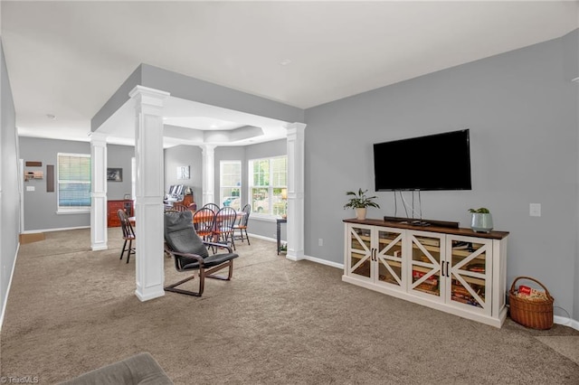 1420 Joyceland Rd, Kernersville, NC 27284 - living area featuring baseboards, carpet floors, a raised ceiling, and ornate columns
