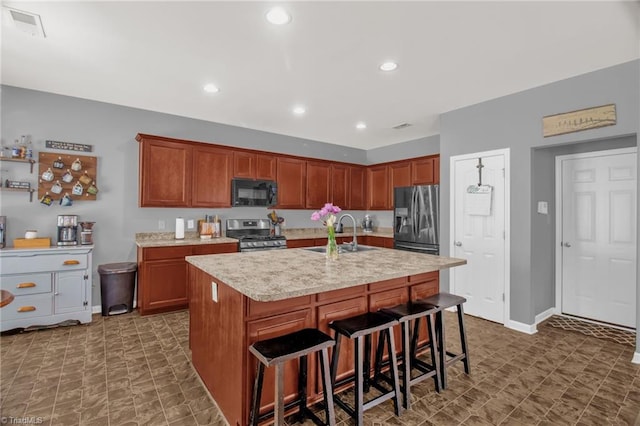 1420 Joyceland Rd, Kernersville, NC 27284 - kitchen with stainless steel gas range oven, fridge with ice dispenser, visible vents, a sink, and black microwave