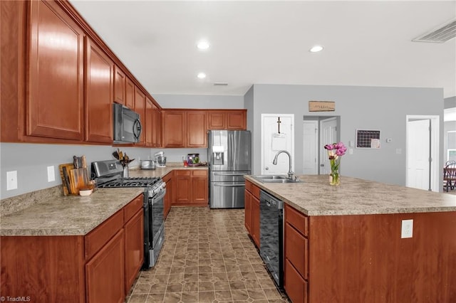 1420 Joyceland Rd, Kernersville, NC 27284 - kitchen with a sink, black appliances, an island with sink, light countertops, and recessed lighting