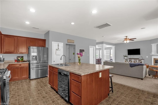 1420 Joyceland Rd, Kernersville, NC 27284 - kitchen featuring a ceiling fan, a sink, stainless steel appliances, visible vents, and ornate columns