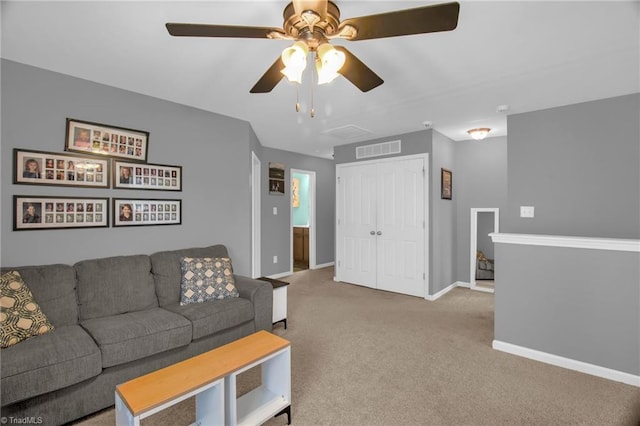 1420 Joyceland Rd, Kernersville, NC 27284 - living area featuring carpet, visible vents, a ceiling fan, and baseboards