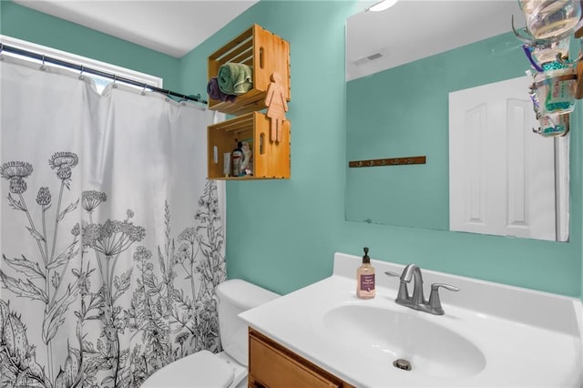 1420 Joyceland Rd, Kernersville, NC 27284 - full bathroom with toilet, vanity, curtained shower, and visible vents