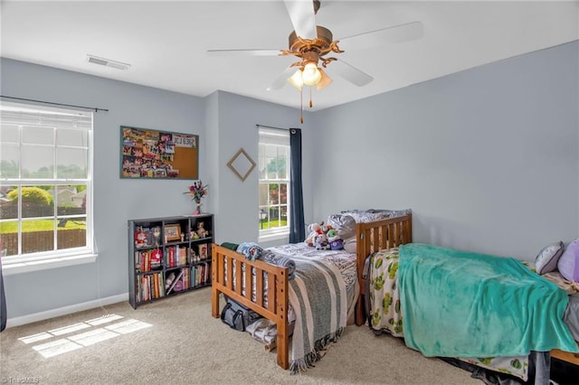 1420 Joyceland Rd, Kernersville, NC 27284 - bedroom featuring carpet floors, visible vents, a ceiling fan, and baseboards
