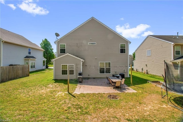 1420 Joyceland Rd, Kernersville, NC 27284 - rear view of property featuring fence, a yard, a patio, and a trampoline