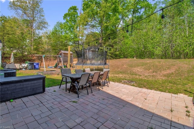 1420 Joyceland Rd, Kernersville, NC 27284 - view of patio / terrace featuring a playground, outdoor dining space, and a trampoline