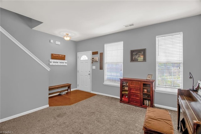 1420 Joyceland Rd, Kernersville, NC 27284 - entrance foyer with baseboards, visible vents, and carpet flooring