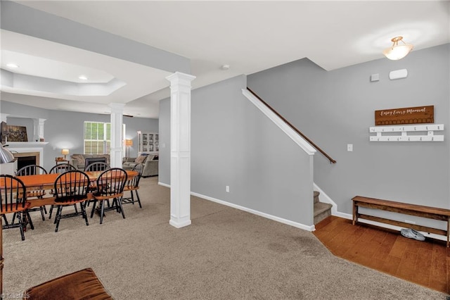 1420 Joyceland Rd, Kernersville, NC 27284 - dining area with baseboards, carpet floors, stairs, and ornate columns