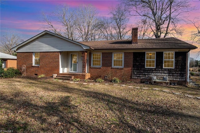 ranch-style house featuring a lawn