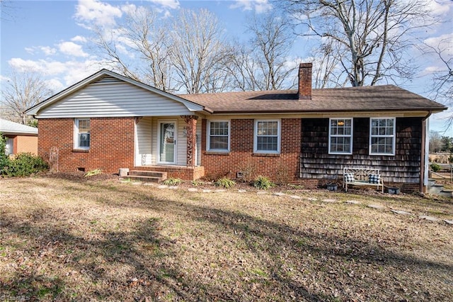 single story home featuring a front lawn