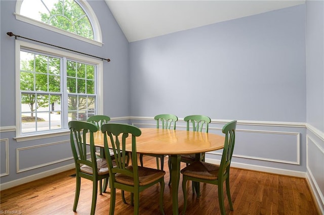 5711 Beaver Pond Trl, Pfafftown, NC 27040 - dining room with lofted ceiling, light wood-style floors, and a wainscoted wall