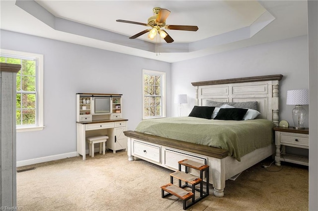5711 Beaver Pond Trl, Pfafftown, NC 27040 - bedroom with carpet flooring, a raised ceiling, ceiling fan, and baseboards