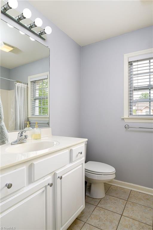 5711 Beaver Pond Trl, Pfafftown, NC 27040 - full bathroom with toilet, vanity, tile patterned flooring, and a shower with shower curtain
