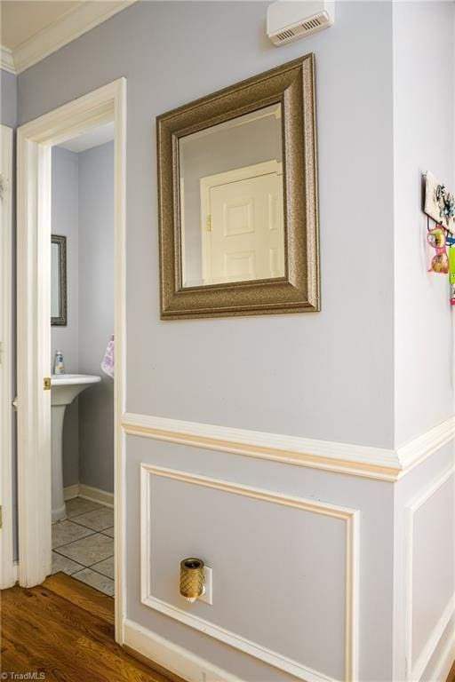 5711 Beaver Pond Trl, Pfafftown, NC 27040 - corridor with wood finished floors and ornamental molding