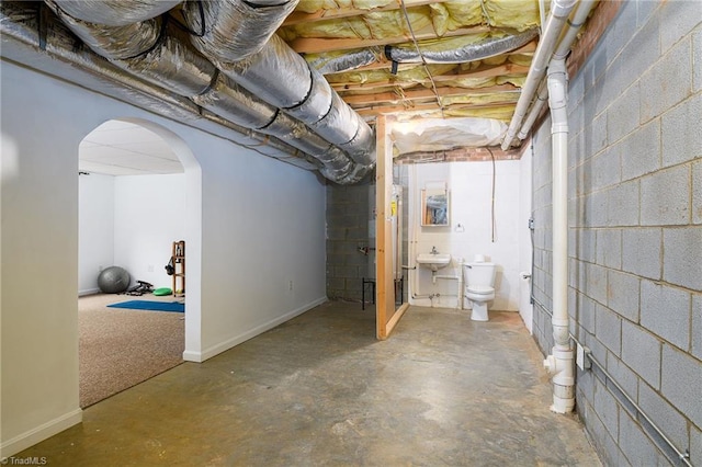 5711 Beaver Pond Trl, Pfafftown, NC 27040 - unfinished basement featuring arched walkways and concrete block wall