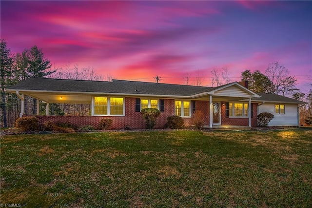 ranch-style house with a lawn