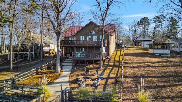 back of property featuring a balcony