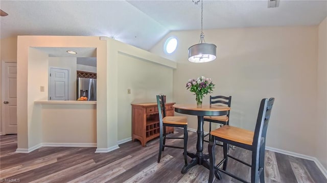 4401 Barndale Ct, Jamestown, NC 27282 - dining space with vaulted ceiling and wood finished floors
