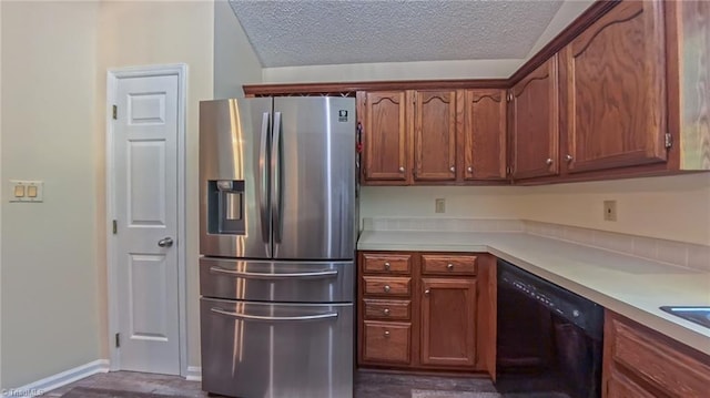 4401 Barndale Ct, Jamestown, NC 27282 - kitchen featuring stainless steel fridge, dishwasher, light countertops, a textured ceiling, and brown cabinetry