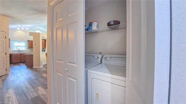 4401 Barndale Ct, Jamestown, NC 27282 - laundry room featuring a textured ceiling, wood finished floors, and washing machine and dryer