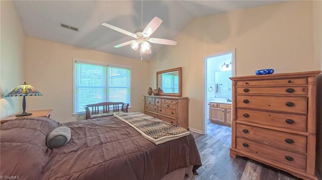 4401 Barndale Ct, Jamestown, NC 27282 - bedroom featuring vaulted ceiling, dark wood-style floors, connected bathroom, and a ceiling fan